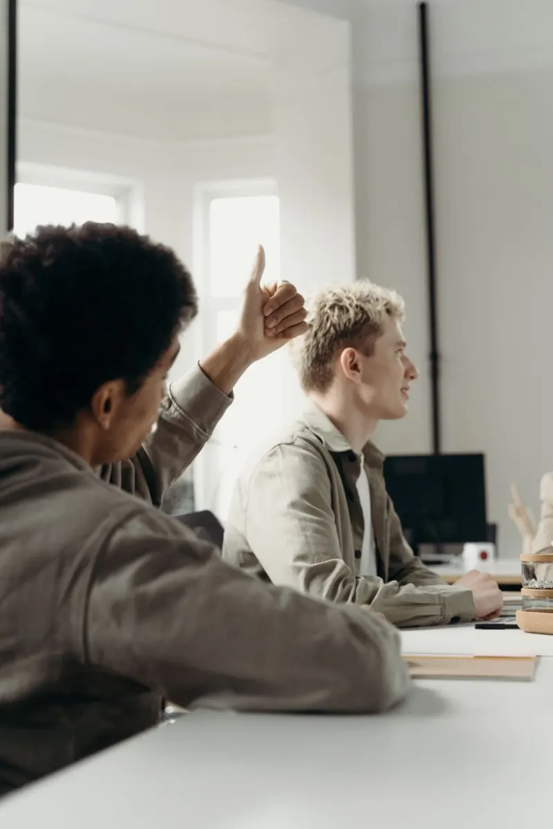 Professional team engaged in collaborative discussion in a modern office setting.